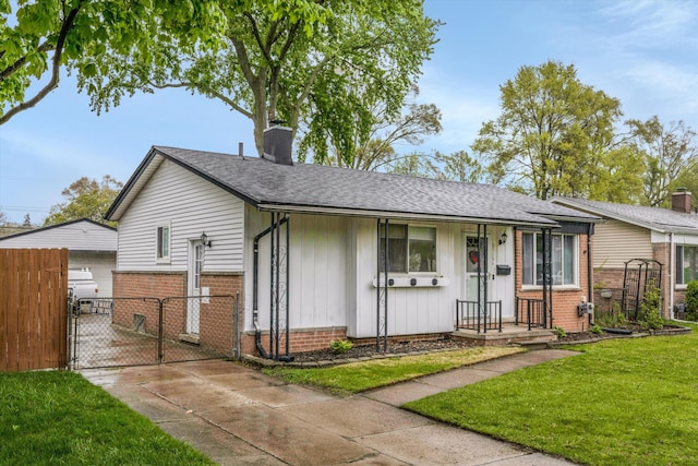 view of front of home with a gate, a chimney, board and batten siding, brick siding, and roof with shingles