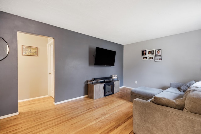 living room featuring light wood-style floors and baseboards