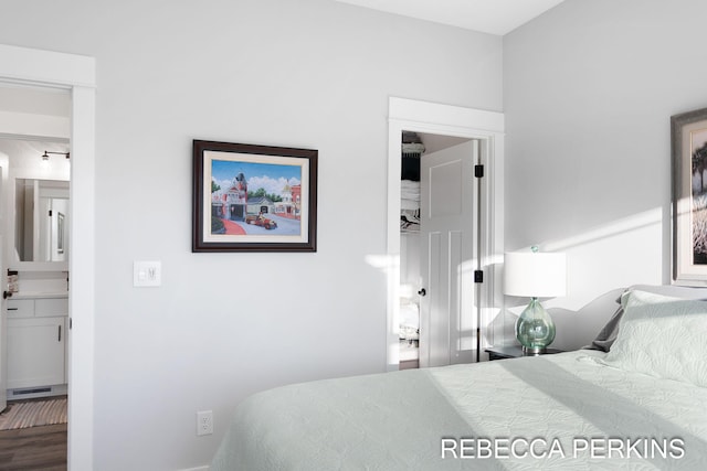 4497 Point Superior Ct, Holland, MI 49424 - bedroom with wood finished floors, ensuite bathroom, and baseboards