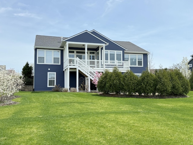 4497 Point Superior Ct, Holland, MI 49424 - rear view of property featuring a yard, stairway, and roof with shingles