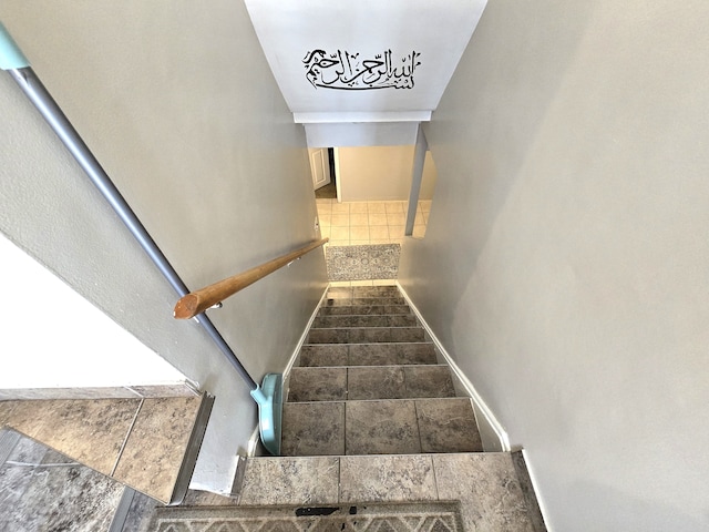 stairs featuring tile patterned flooring