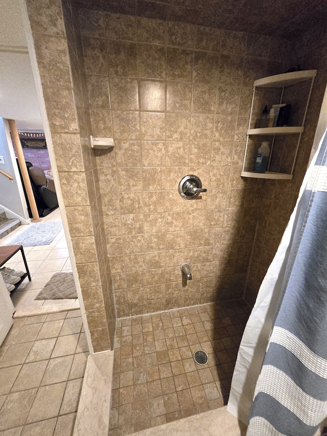 bathroom with tiled shower