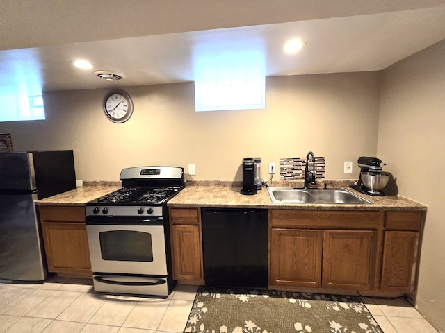 kitchen with stainless steel appliances, a sink, light tile patterned floors, recessed lighting, and brown cabinetry