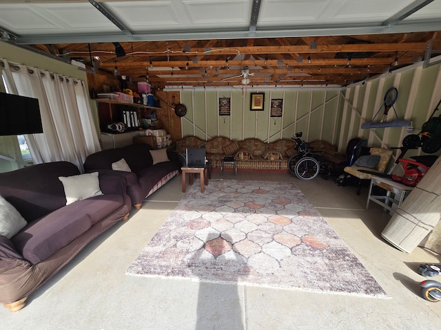 living area with a garage and concrete floors