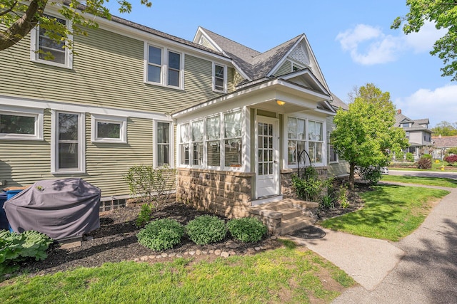 view of front of house featuring a sunroom