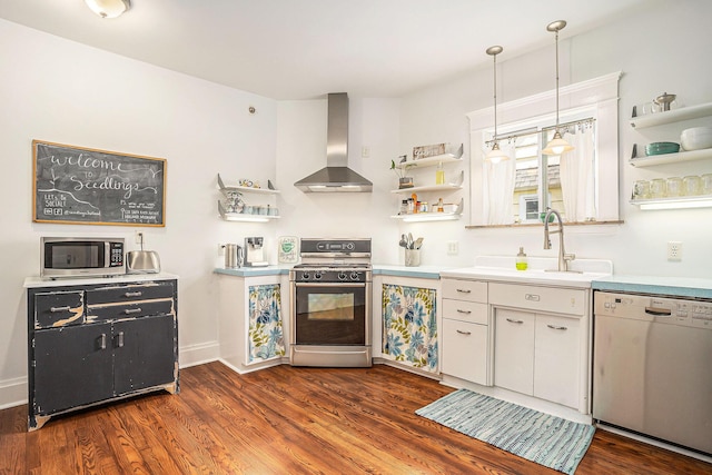 kitchen with open shelves, wall chimney exhaust hood, gas range oven, dishwasher, and stainless steel microwave