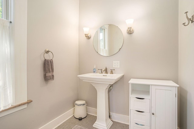 bathroom featuring tile patterned floors and baseboards