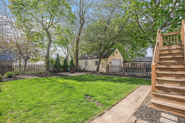 view of yard with an outbuilding, stairway, and a patio