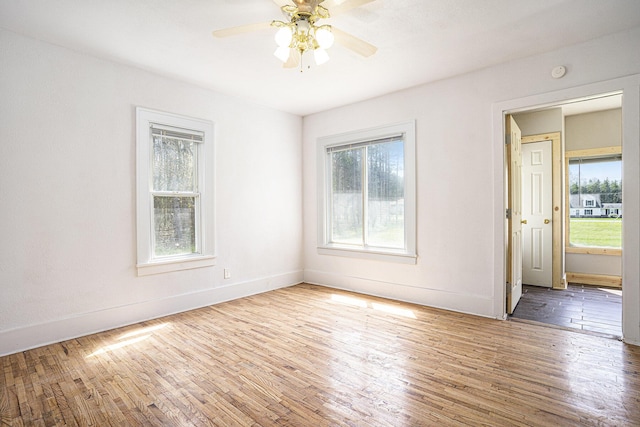 5128 Heights Ravenna Rd, Fruitport, MI 49415 - empty room featuring ceiling fan, wood finished floors, baseboards, and a smoke detector