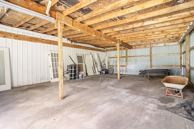 5128 Heights Ravenna Rd, Fruitport, MI 49415 - miscellaneous room with a garage and unfinished concrete flooring