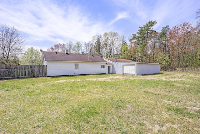 5128 Heights Ravenna Rd, Fruitport, MI 49415 - rear view of property with a detached garage
