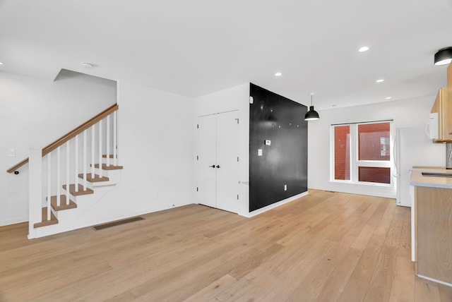 112 Mount Vernon St, Detroit, MI 48202 - entryway with light wood-style flooring, stairway, recessed lighting, and baseboards
