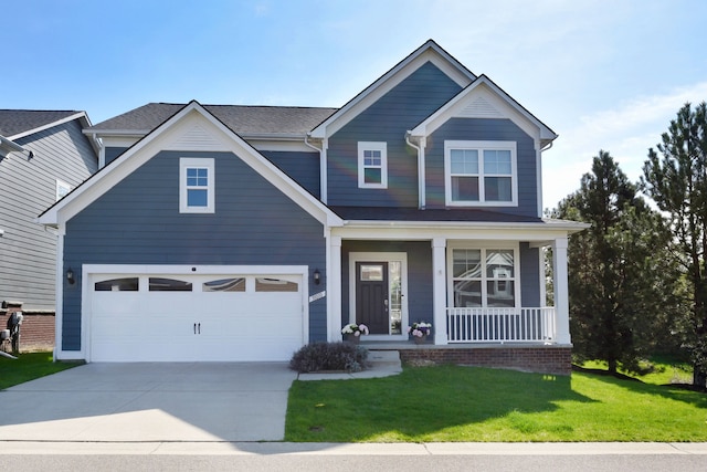 craftsman-style home featuring covered porch, a front lawn, concrete driveway, and a garage