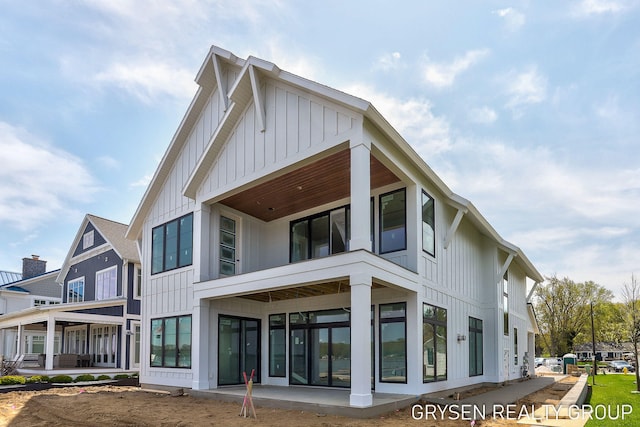 1351 Bayview Dr, Holland, MI 49423 - rear view of house with board and batten siding