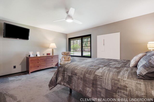 carpeted bedroom featuring a ceiling fan