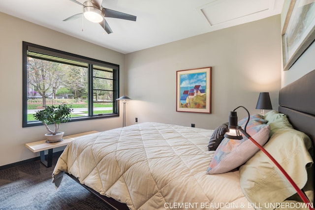 bedroom featuring attic access, ceiling fan, and baseboards