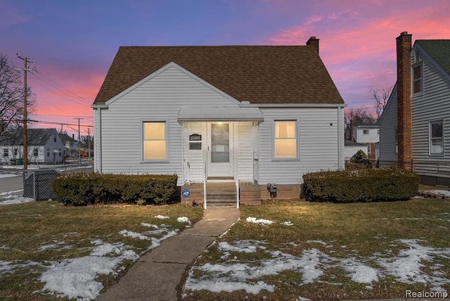 view of front of property featuring roof with shingles