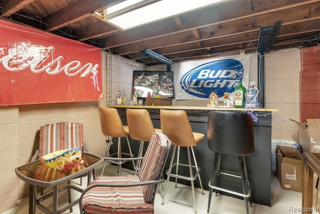 indoor dry bar with concrete flooring