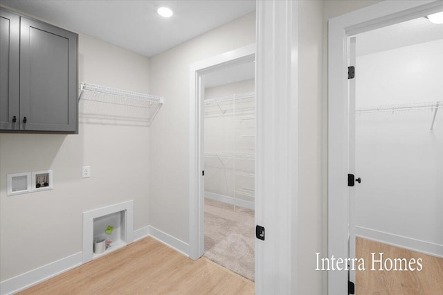 3772 Ambrosia Dr SW Unit 25, Grand Rapids, MI 49534 - laundry room featuring cabinet space, washer hookup, light wood-style flooring, baseboards, and recessed lighting