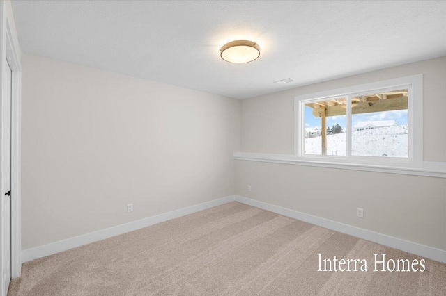 3772 Ambrosia Dr SW Unit 25, Grand Rapids, MI 49534 - spare room featuring light colored carpet and baseboards