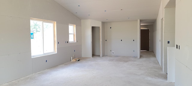 3772 Ambrosia Dr SW Unit 25, Grand Rapids, MI 49534 - spare room featuring lofted ceiling and unfinished concrete flooring