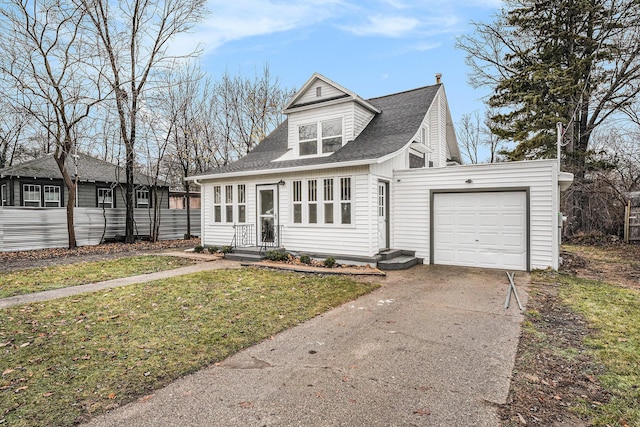 view of front of house featuring concrete driveway, a garage, a chimney, and a shingled roof