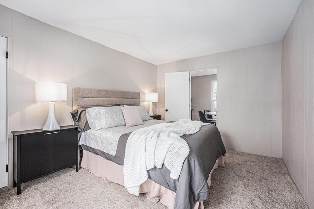 bedroom with light colored carpet