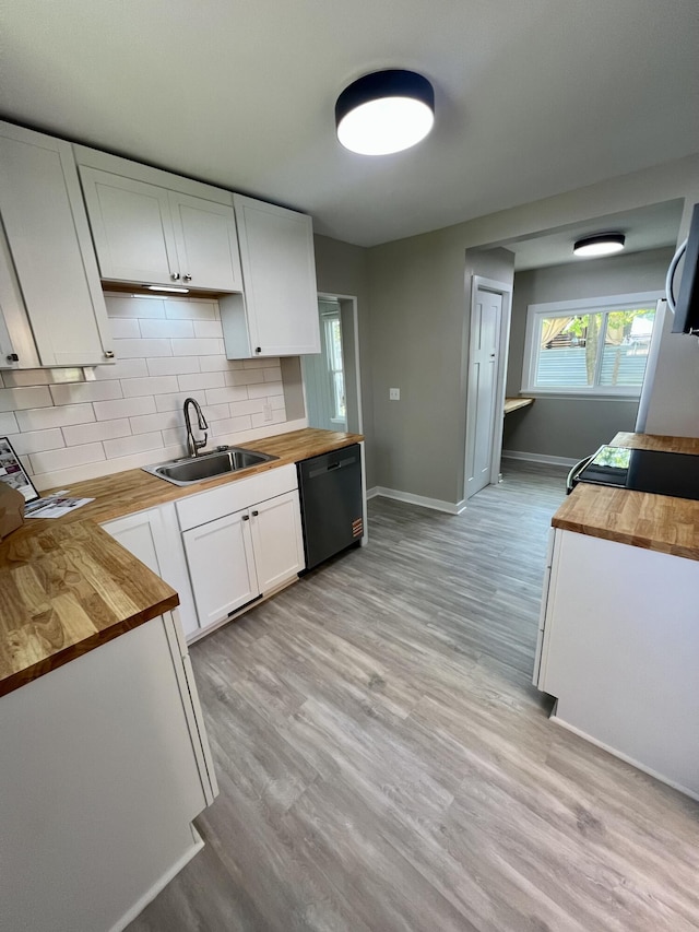 109 S Lake Ave, Spring Lake, MI 49456 - kitchen featuring wood counters, dishwasher, a sink, white cabinets, and backsplash