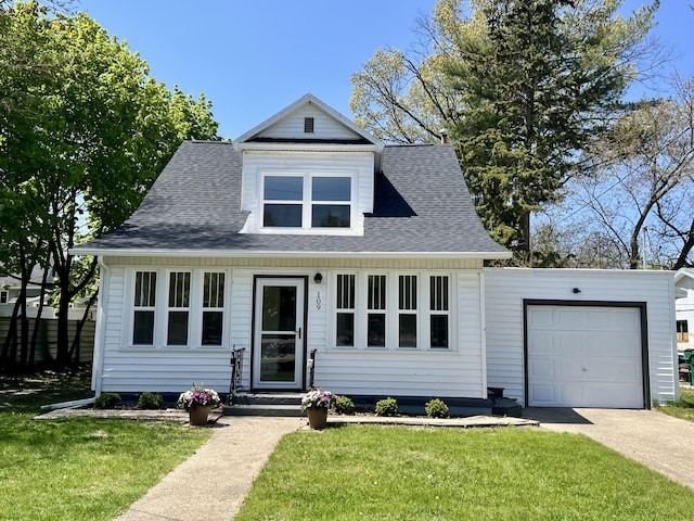 109 S Lake Ave, Spring Lake, MI 49456 - view of front facade with a front lawn, a garage, entry steps, roof with shingles, and concrete driveway