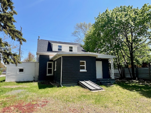 109 S Lake Ave, Spring Lake, MI 49456 - rear view of house with a yard and a shingled roof