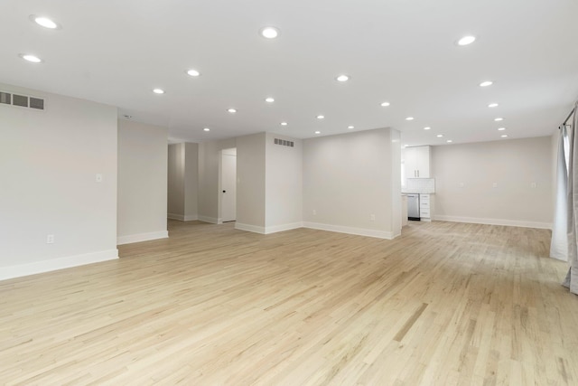 25720 Southwood Dr, Southfield, MI 48075 - unfurnished living room with light wood-style floors, baseboards, and recessed lighting