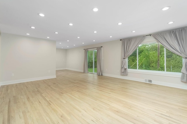 25720 Southwood Dr, Southfield, MI 48075 - unfurnished living room with light wood-style floors, recessed lighting, and baseboards