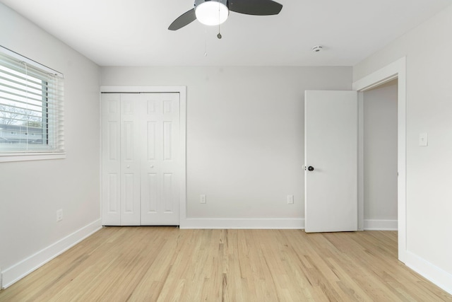 25720 Southwood Dr, Southfield, MI 48075 - unfurnished bedroom featuring wood finished floors, baseboards, a closet, and a ceiling fan