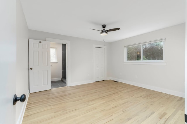 25720 Southwood Dr, Southfield, MI 48075 - unfurnished bedroom featuring baseboards, light wood-style flooring, and ceiling fan