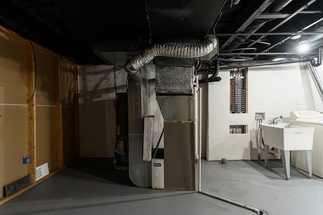 25720 Southwood Dr, Southfield, MI 48075 - unfinished basement featuring washer / dryer and heating unit