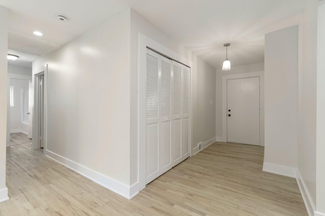 25720 Southwood Dr, Southfield, MI 48075 - hall with light wood-style flooring, baseboards, and recessed lighting