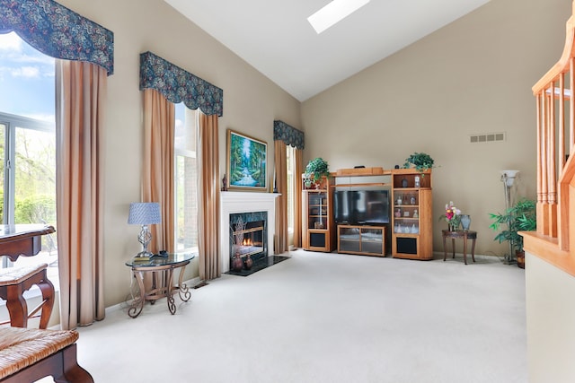 61450 Wedgewood Dr, Washington, MI 48094 - living room with carpet floors, a high end fireplace, a skylight, high vaulted ceiling, and baseboards