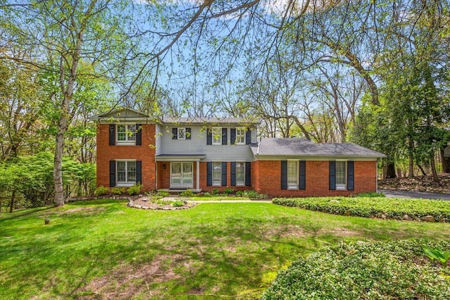 5445 Washakie Trl, Brighton, MI 48116 - colonial house with a front yard and brick siding