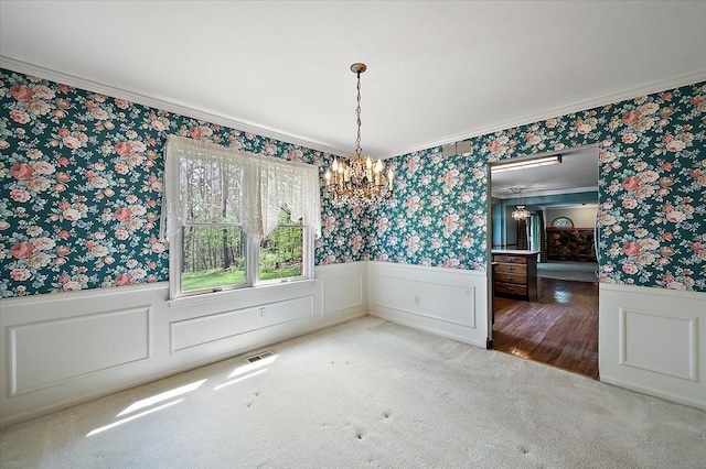 5445 Washakie Trl, Brighton, MI 48116 - unfurnished dining area featuring wallpapered walls, a chandelier, a wainscoted wall, crown molding, and carpet flooring