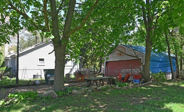 1209 Applewood Dr, White Lake, MI 48386 - exterior space with fence and a detached garage