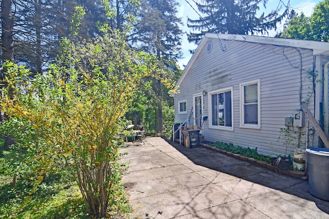 1209 Applewood Dr, White Lake, MI 48386 - view of property exterior featuring a patio area