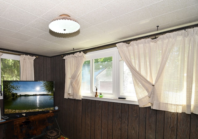 1209 Applewood Dr, White Lake, MI 48386 - unfurnished room with plenty of natural light and wooden walls
