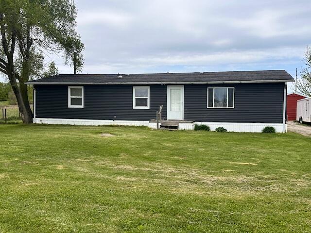 1120 W Montgomery Rd, Camden, MI 49232 - view of front of home with a front lawn