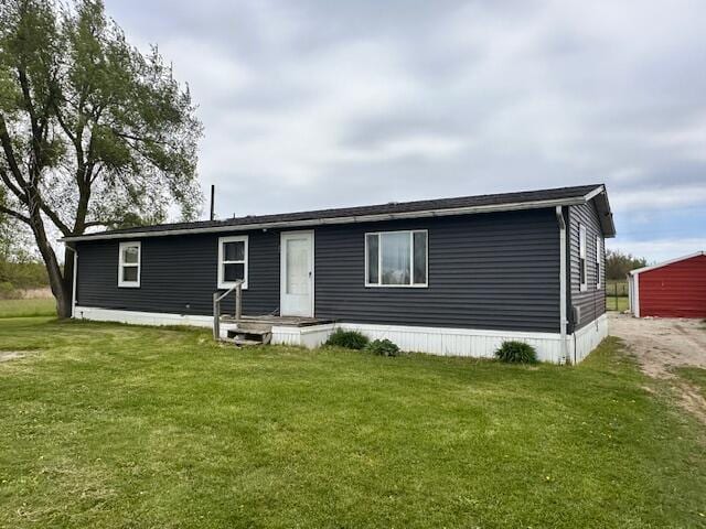 1120 W Montgomery Rd, Camden, MI 49232 - view of front of house featuring a front lawn and dirt driveway