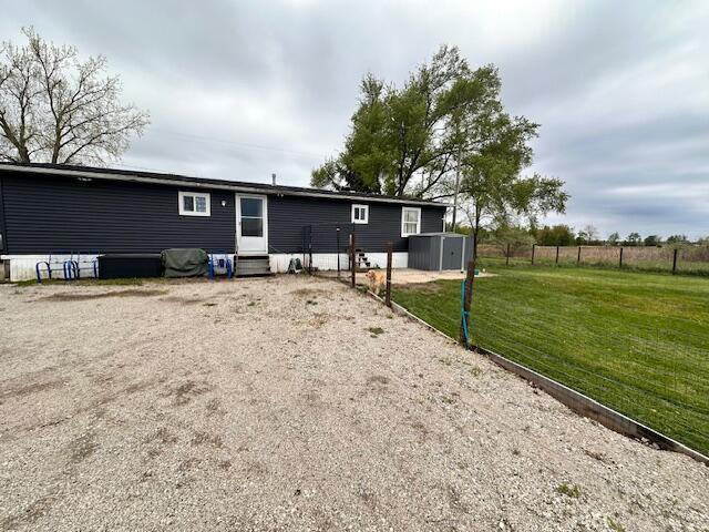 1120 W Montgomery Rd, Camden, MI 49232 - rear view of house with entry steps