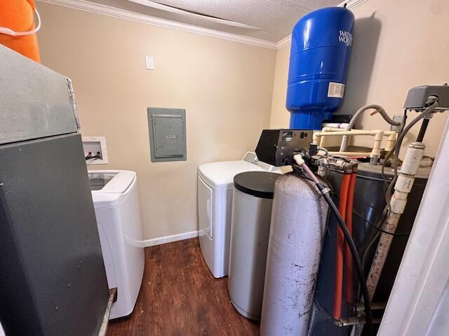 1120 W Montgomery Rd, Camden, MI 49232 - washroom featuring washing machine and clothes dryer, ornamental molding, electric panel, wood finished floors, and baseboards