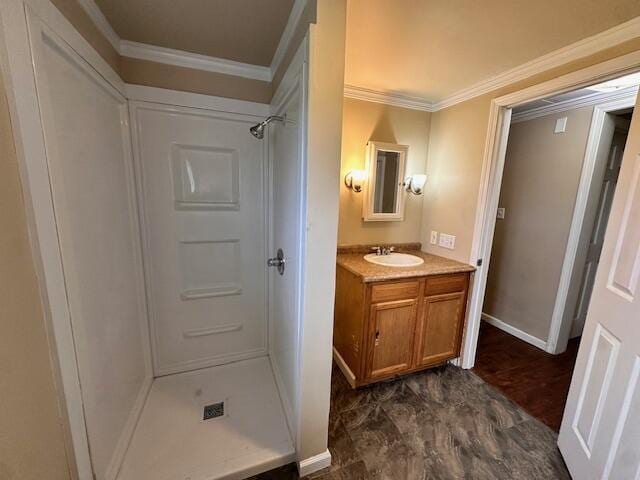 1120 W Montgomery Rd, Camden, MI 49232 - full bathroom with a shower stall, vanity, ornamental molding, baseboards, and wood finished floors