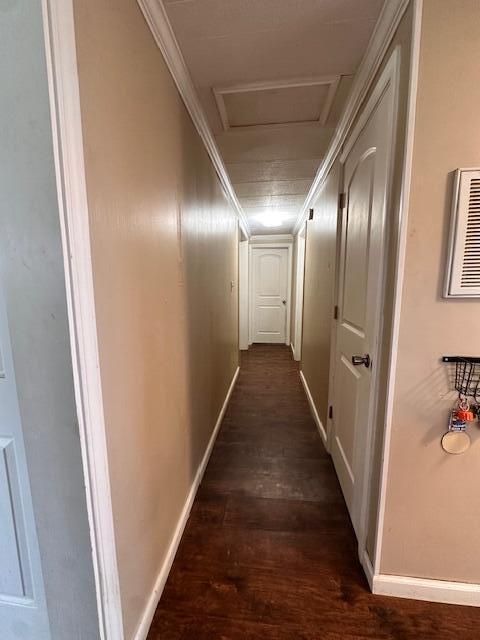 1120 W Montgomery Rd, Camden, MI 49232 - corridor with attic access, dark wood-style floors, and baseboards