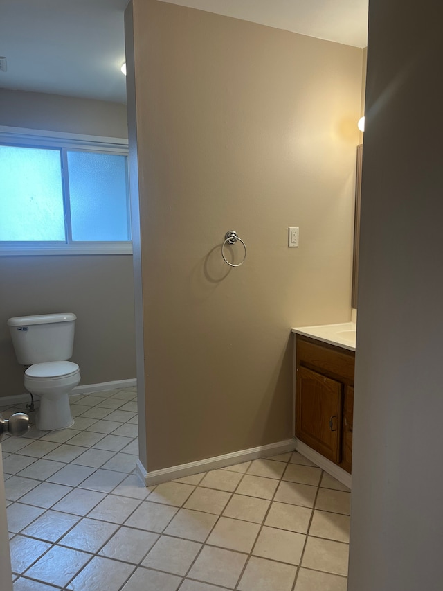 31124 Windsor St, Westland, MI 48185 - half bathroom with tile patterned floors, vanity, baseboards, and toilet