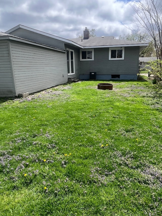 31124 Windsor St, Westland, MI 48185 - back of property with a yard and a chimney